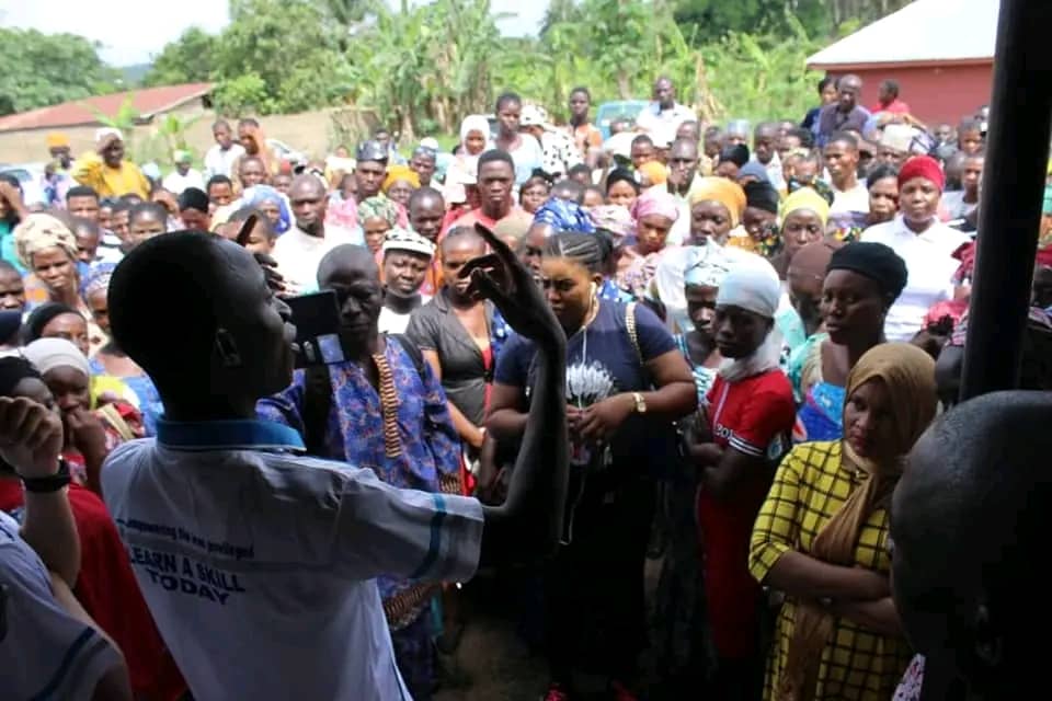 IMSSM officer addressing community members outdoors